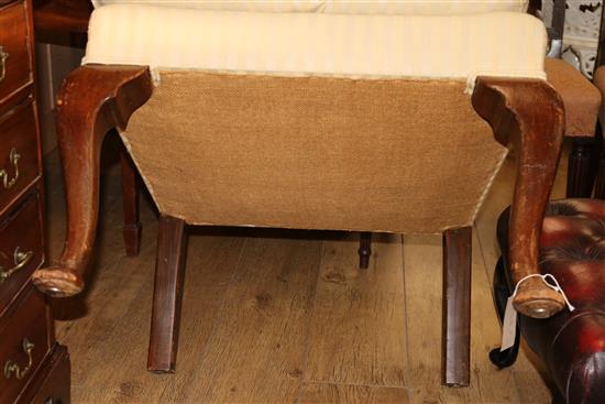 An upholstered wing armchair